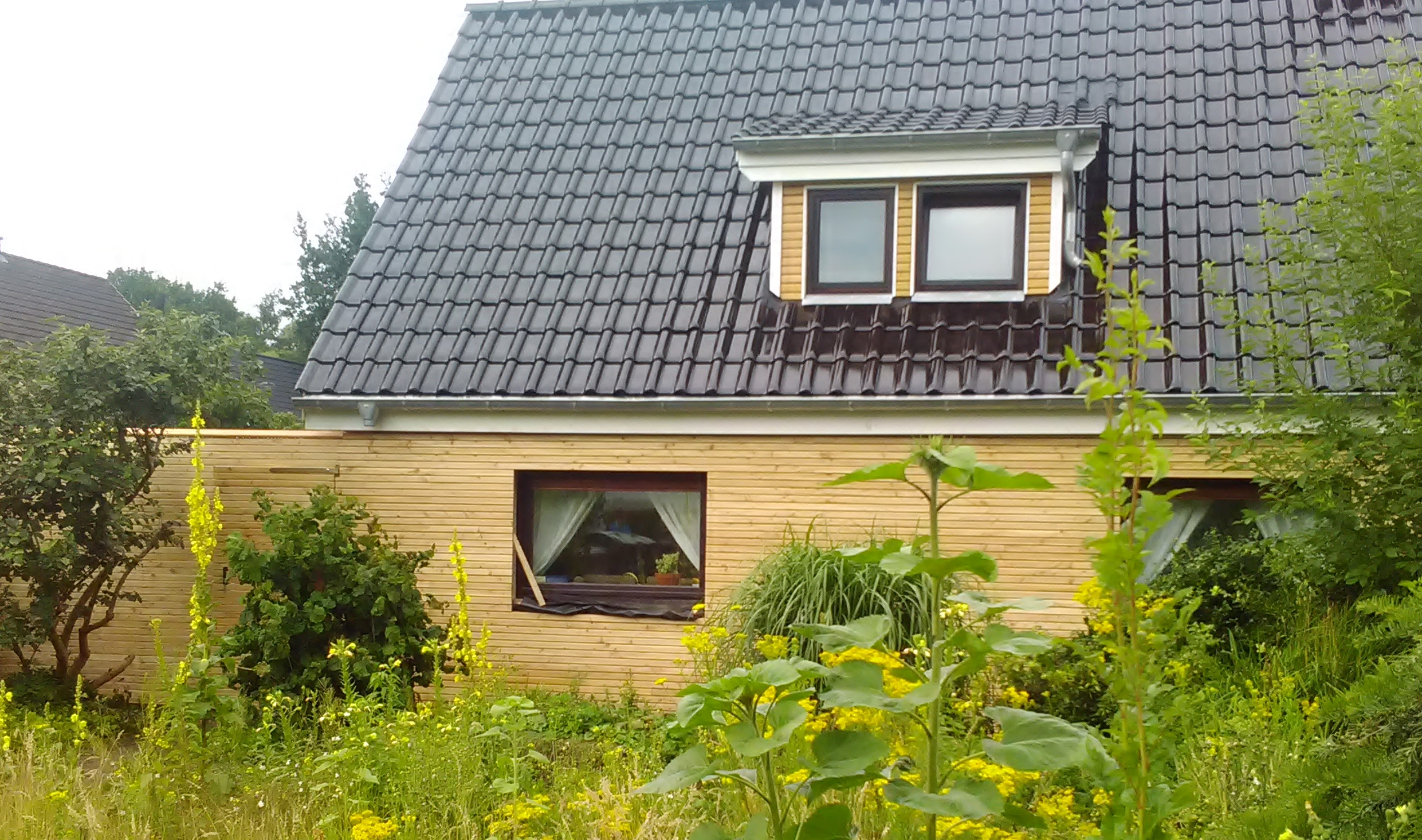 Bestandssanierung Dach mit Rhombus-Fassade
